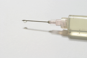 needle with drop ready for injection