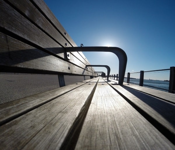 picture of bench in late afternoon blue sky