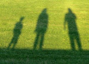 shadow on lawn of family affected by ME/CFS & POTS