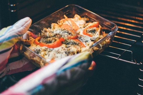 mum with ME/CFS & POTS putting food in oven